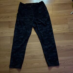 Black and gray camo capri leggings. Light wear on seams. No holes.